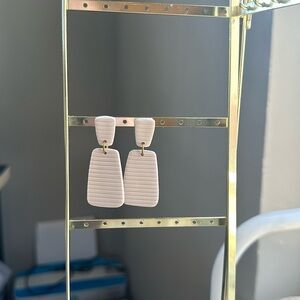 Cream colored double rectangle clay earrings.